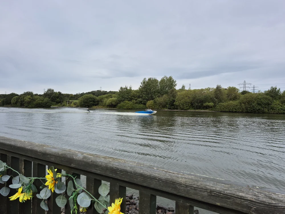 Town Loch Waterski and Wakeboard Center, speedboat towing a water skier.